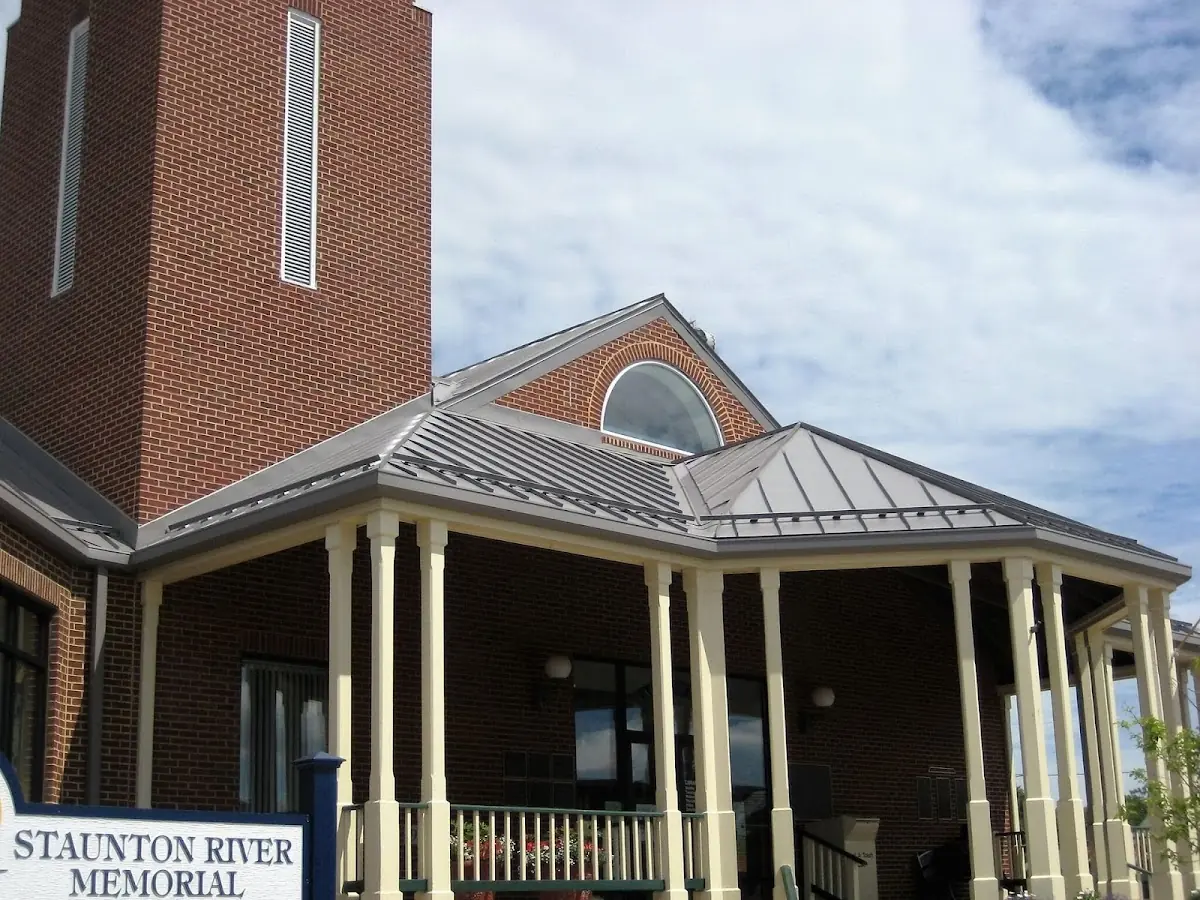 Skilled roofing craftsmen working on a residential roof in Biloxi